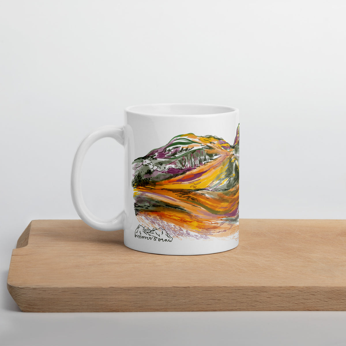 Three Sisters of Glencoe mug displayed on a wooden chopping board