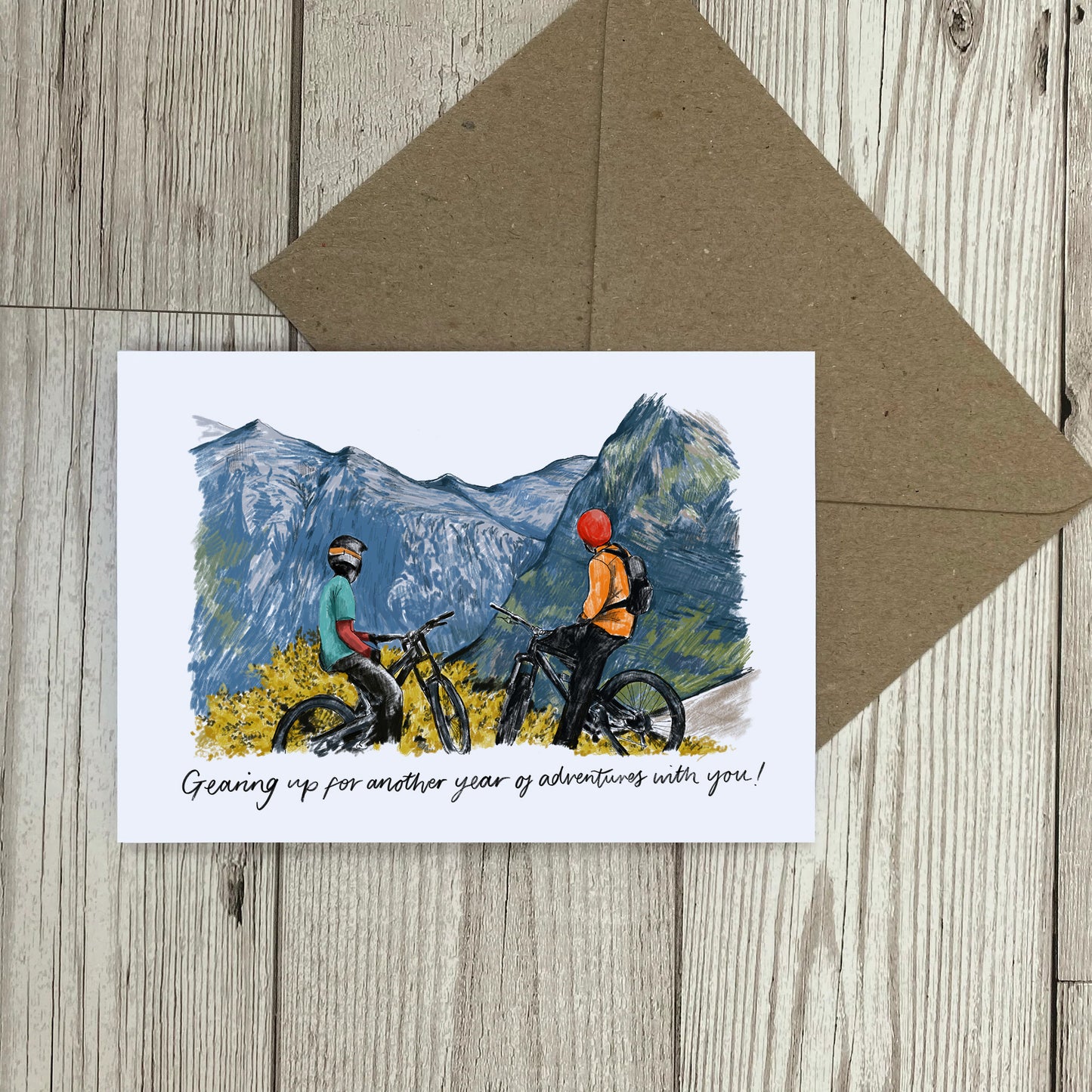 Greetings Card with 2 figures on bikes that reads "Gearing up for another year of adventures with you!"