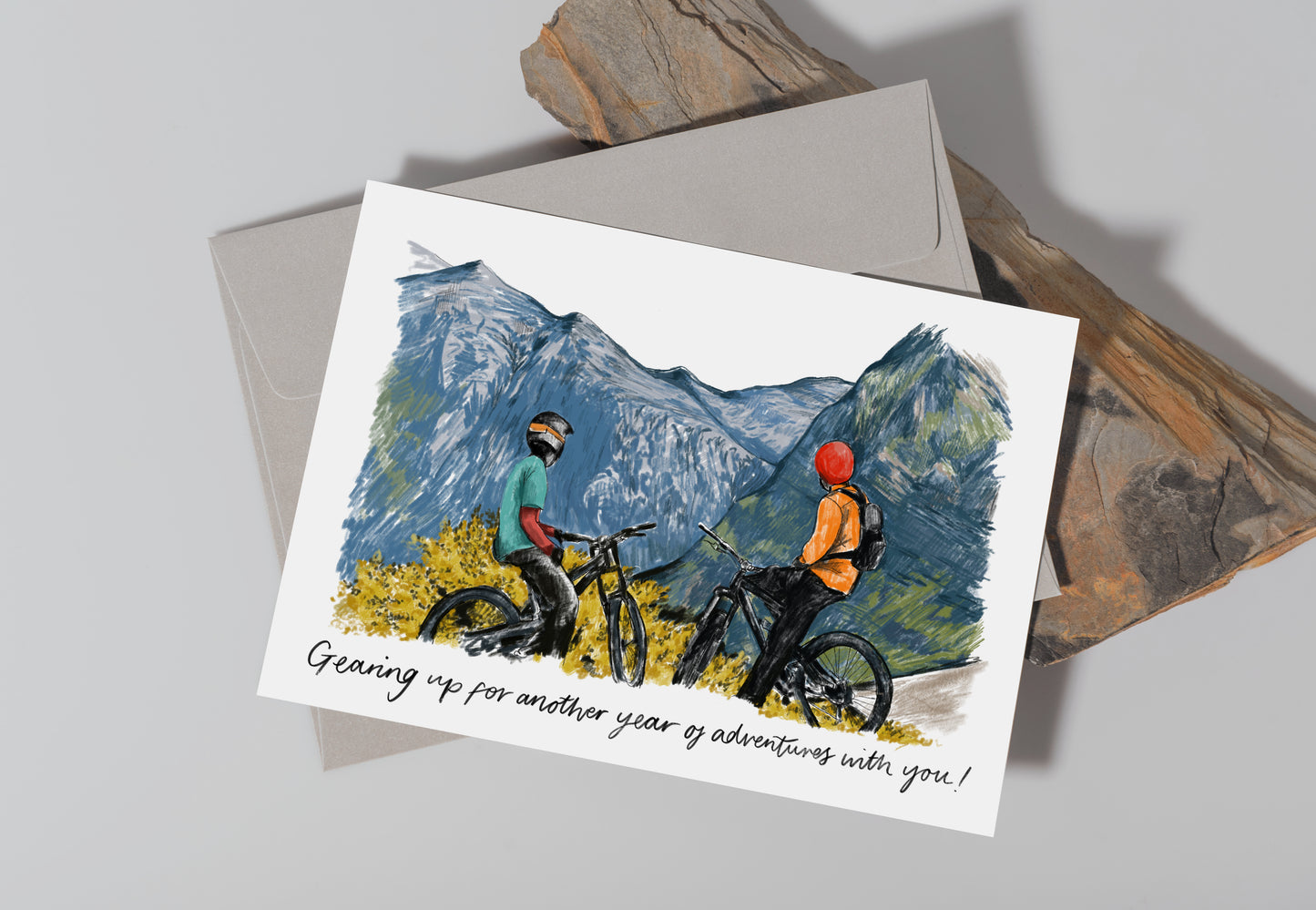 Greetings Card with 2 figures on bikes that reads "Gearing up for another year of adventures with you!"