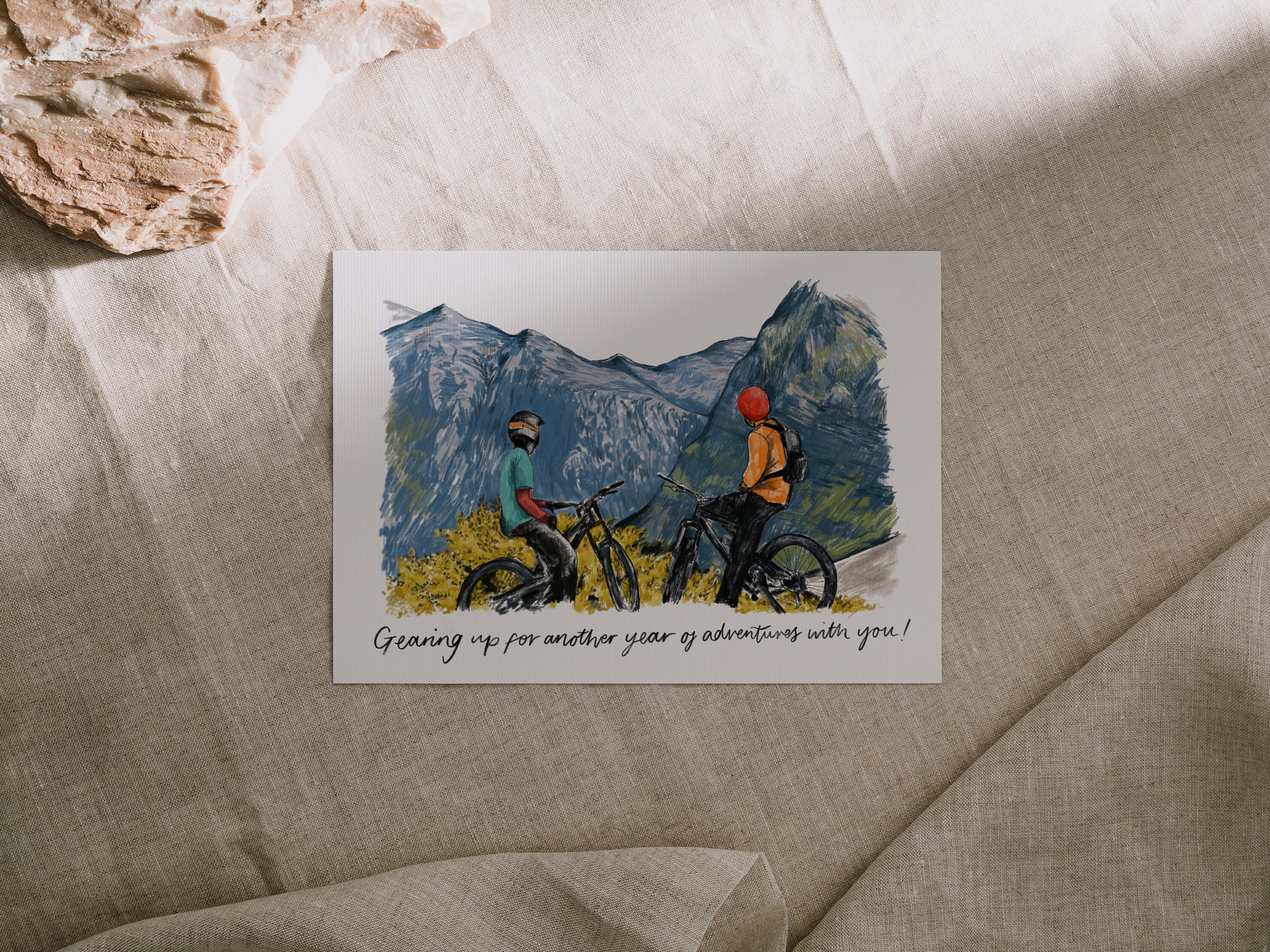 Greetings Card with 2 figures on bikes that reads "Gearing up for another year of adventures with you!"